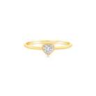 Elegant gold ring with a heart-shaped diamond, perfect for expressing love and style from our luxury jewelry collection.