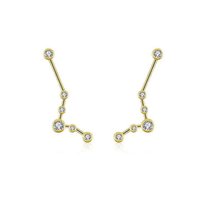 Elegant constellation-inspired gold and diamond earrings from our jewelry brand collection.