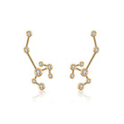 Gold constellation earrings with diamond accents by luxury jewelry brand