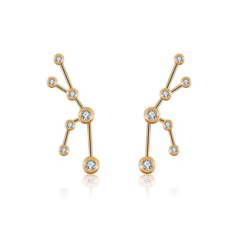 Gold constellation earrings with sparkling gemstones from our luxury jewelry collection