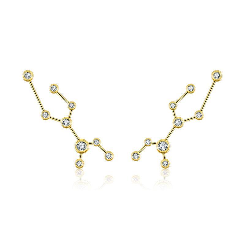 Gold constellation earrings with sparkling embedded gems from our exclusive jewelry collection