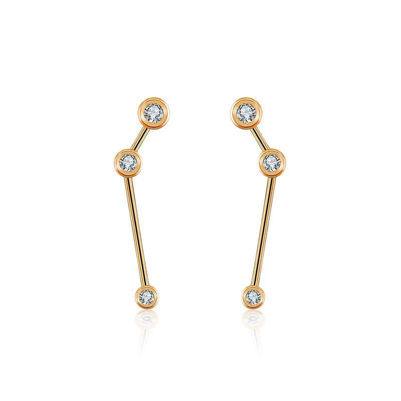 18K gold zodiac constellation diamond earrings showcasing elegant celestial designs and sparkling diamonds.