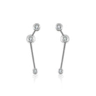 18K gold zodiac constellation diamond earrings featuring sparkling diamonds in celestial designs.