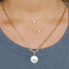 Layered 18K gold zodiac constellation necklace featuring star and celestial designs, perfect for astrology lovers.