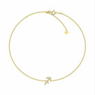 Elegant gold bracelet with diamond-studded arrow charm from our luxury jewelry collection