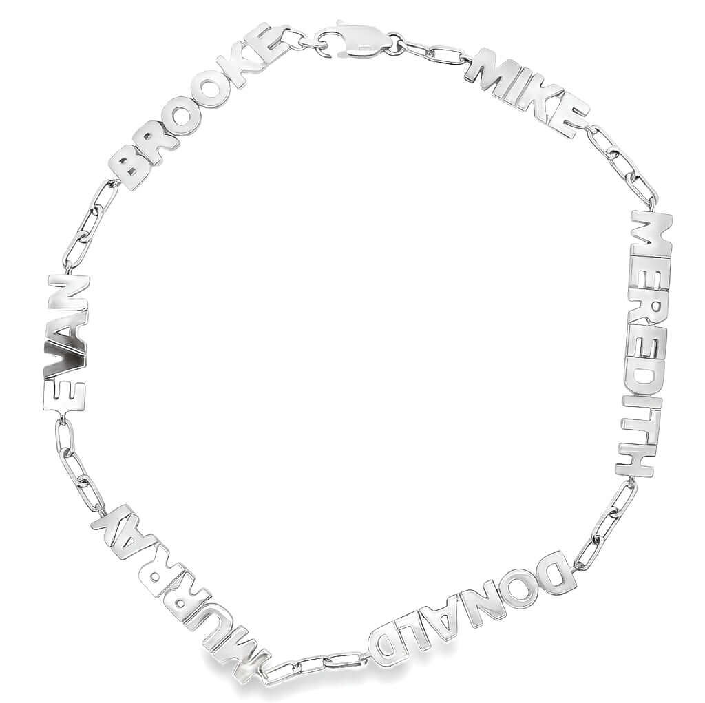 Silver bracelet with engraved names on a white background