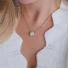Floating Solitaire Lab-Grown Diamond Necklace showcased on a model wearing a cozy sweater.