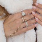 Baguette & Round Diamond Cluster Ring among elegant jewelry on luxurious fur.