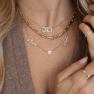 Personalized Multiple Nameplates Heart Diamond Necklace featuring 14k gold and sparkling diamond accents worn by model.
