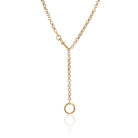 Rolo link gold chain worn with the swivel clasp at the front