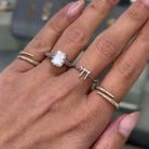 Hebrew Chai Diamond Ring and other fine rings from Izakov Fine Jewelry on a hand.