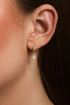 Pear Diamond Drop Huggie Earrings in 14k yellow gold