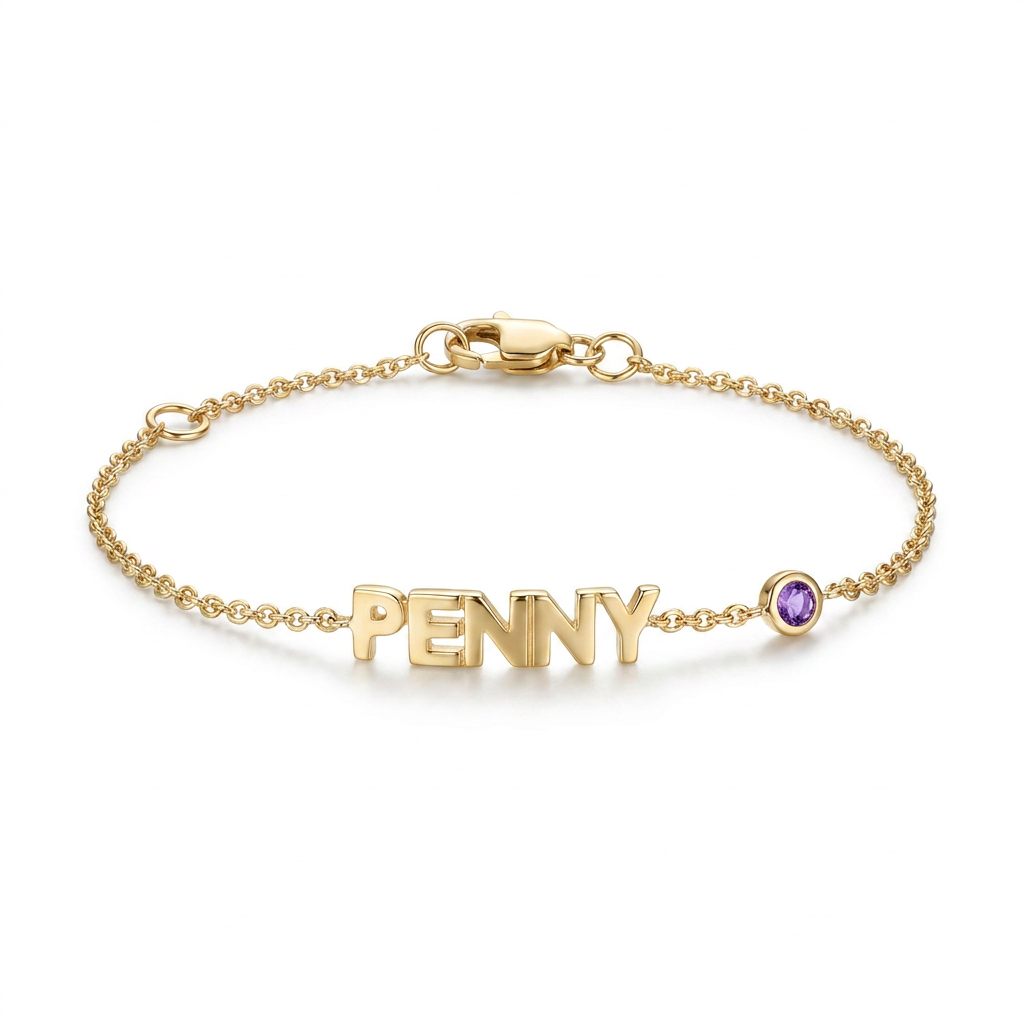 Gold bracelet with 'PENNY' and a purple gemstone on a white background
