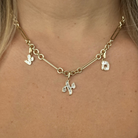 Baguette Diamond Hebrew Initial Necklace Charm featured on a model, showcasing its elegance and design by Izakov Fine Jewelry.