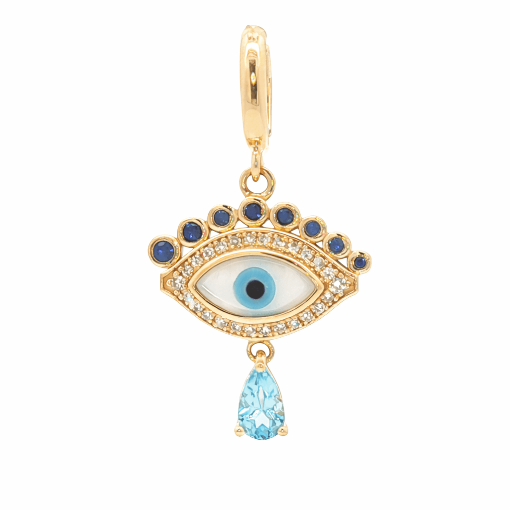Celestial Evil Eye Diamond Charm in 14k gold with diamonds, sapphire accents, and blue topaz drop by izakov fine jewelry Miami.