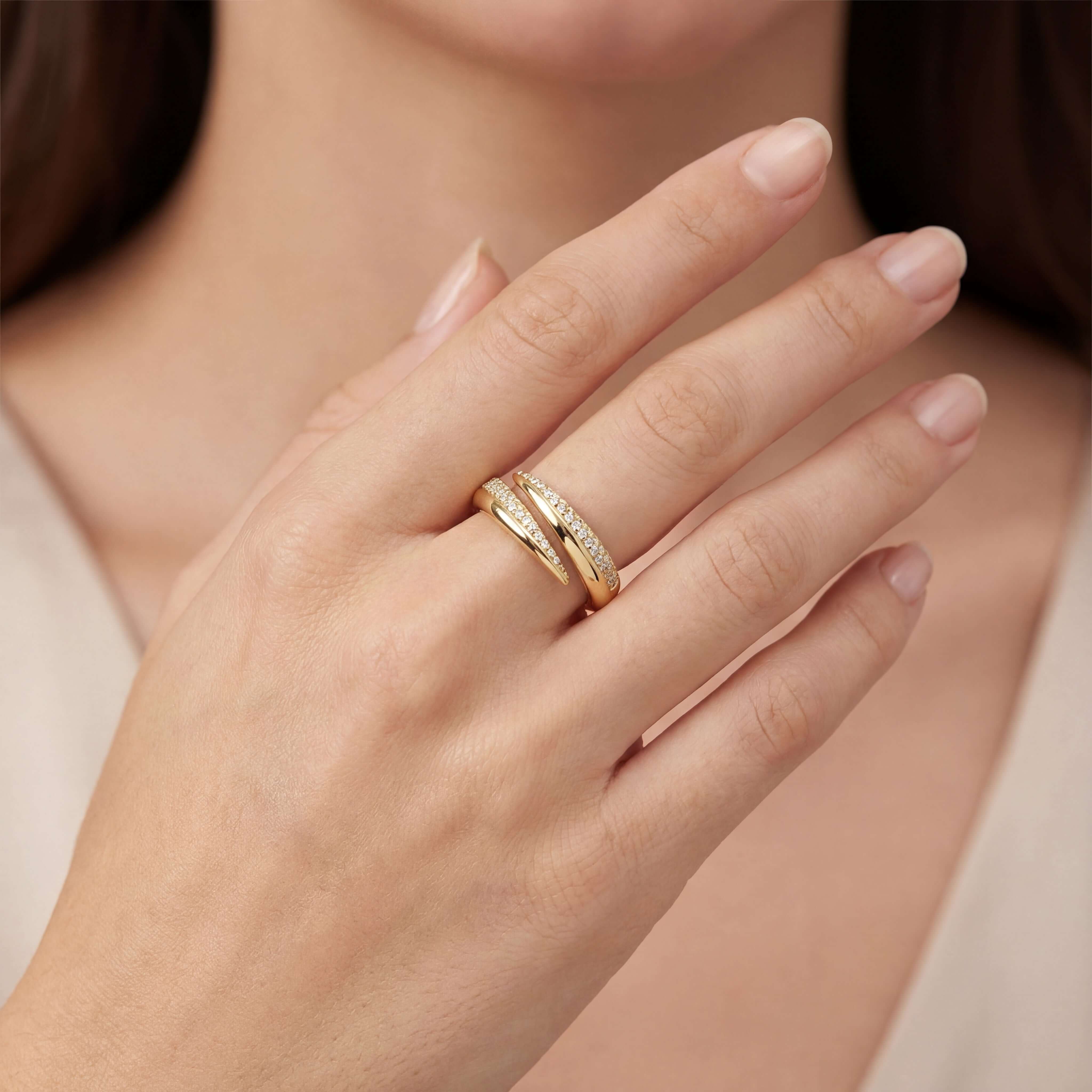 Claw Pave Diamond Wrap Ring worn on a woman's finger, showcasing the elegant claw design and pavé diamonds in 14k gold.
