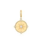 Diamond Compass Coin Charm featuring a starburst design and diamond accents on a polished gold medallion.