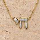 Hebrew Chai Baguette Diamond Necklace in 14K yellow gold, styled, Izakov Fine Jewelry