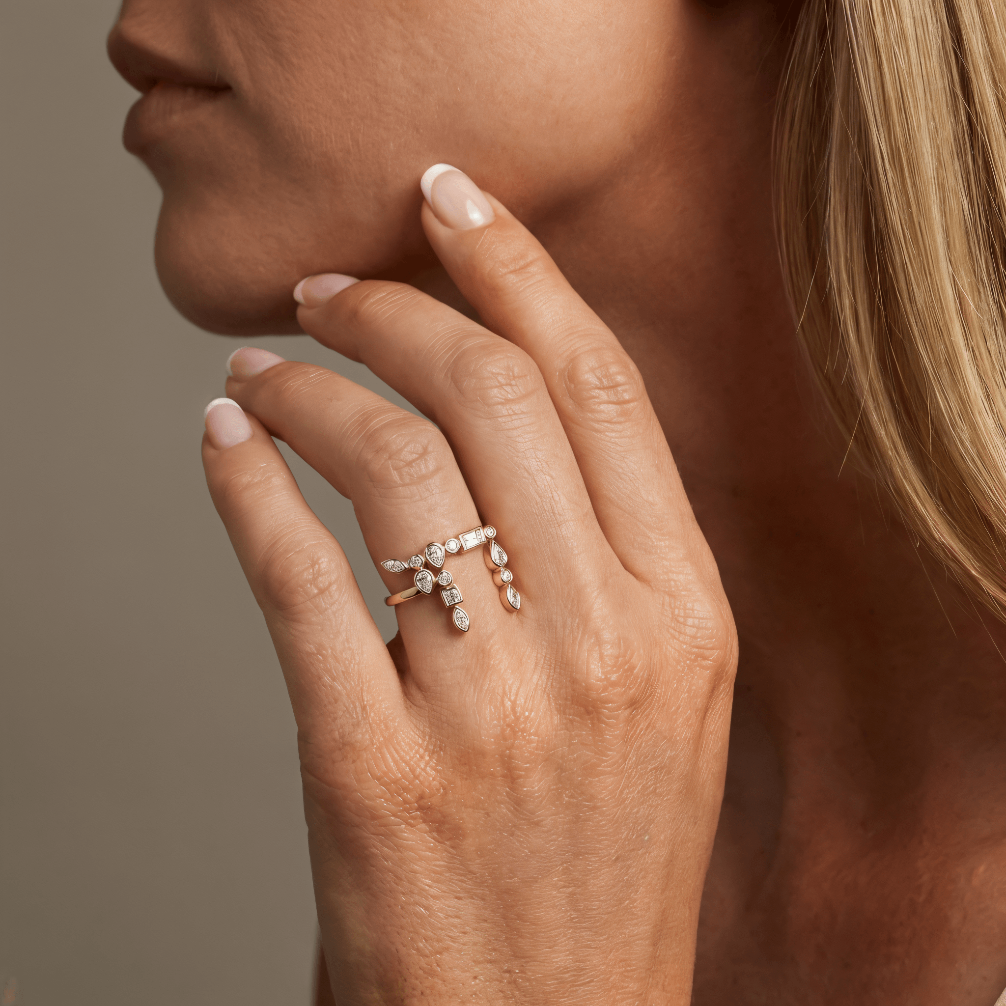 Close-up of a woman's hand showcasing the Hebrew Chai Multi Shape Diamond Ring on her finger.