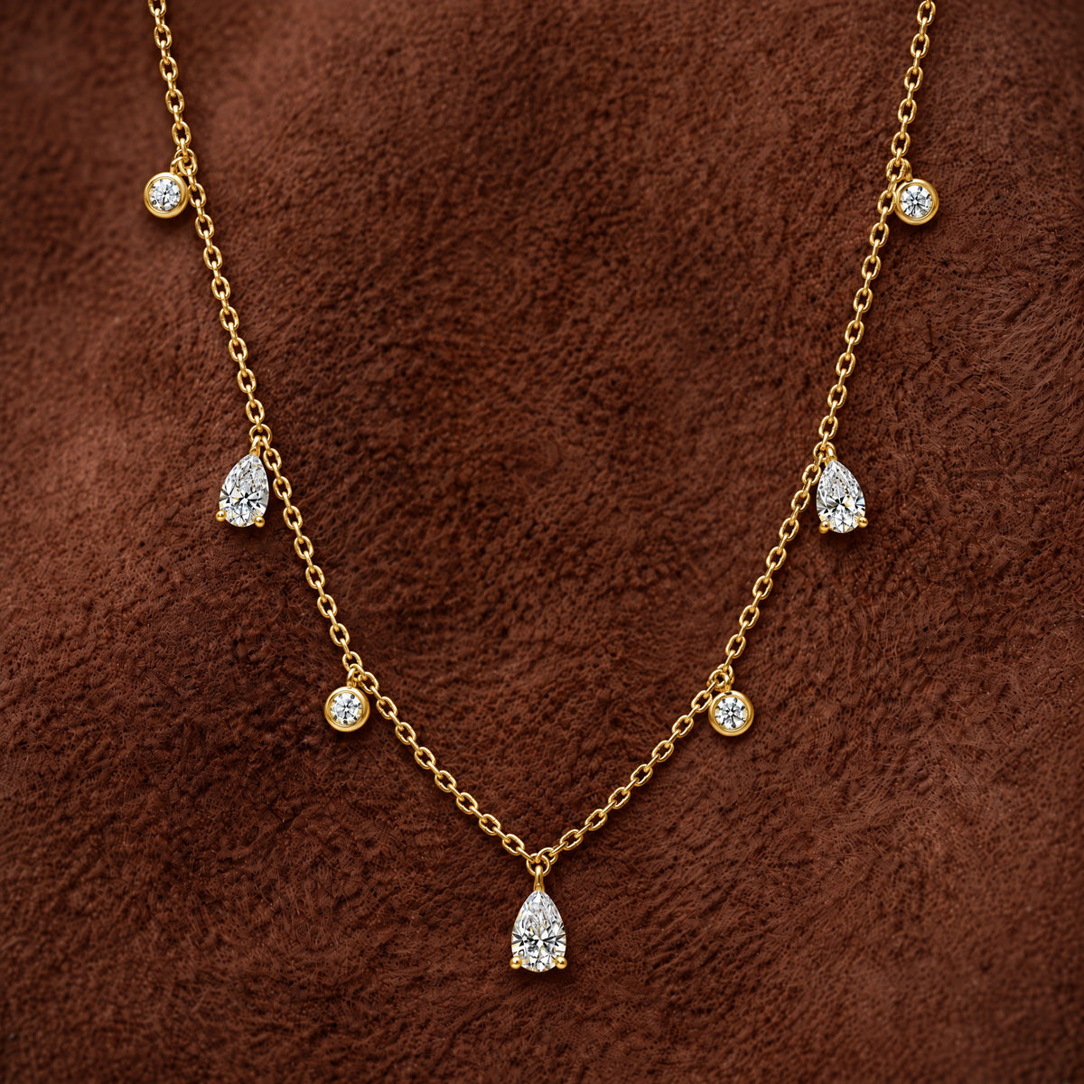 Pear and Round Lab Diamond Dangle Necklace in 14K yellow gold, styled, Izakov Fine Jewelry