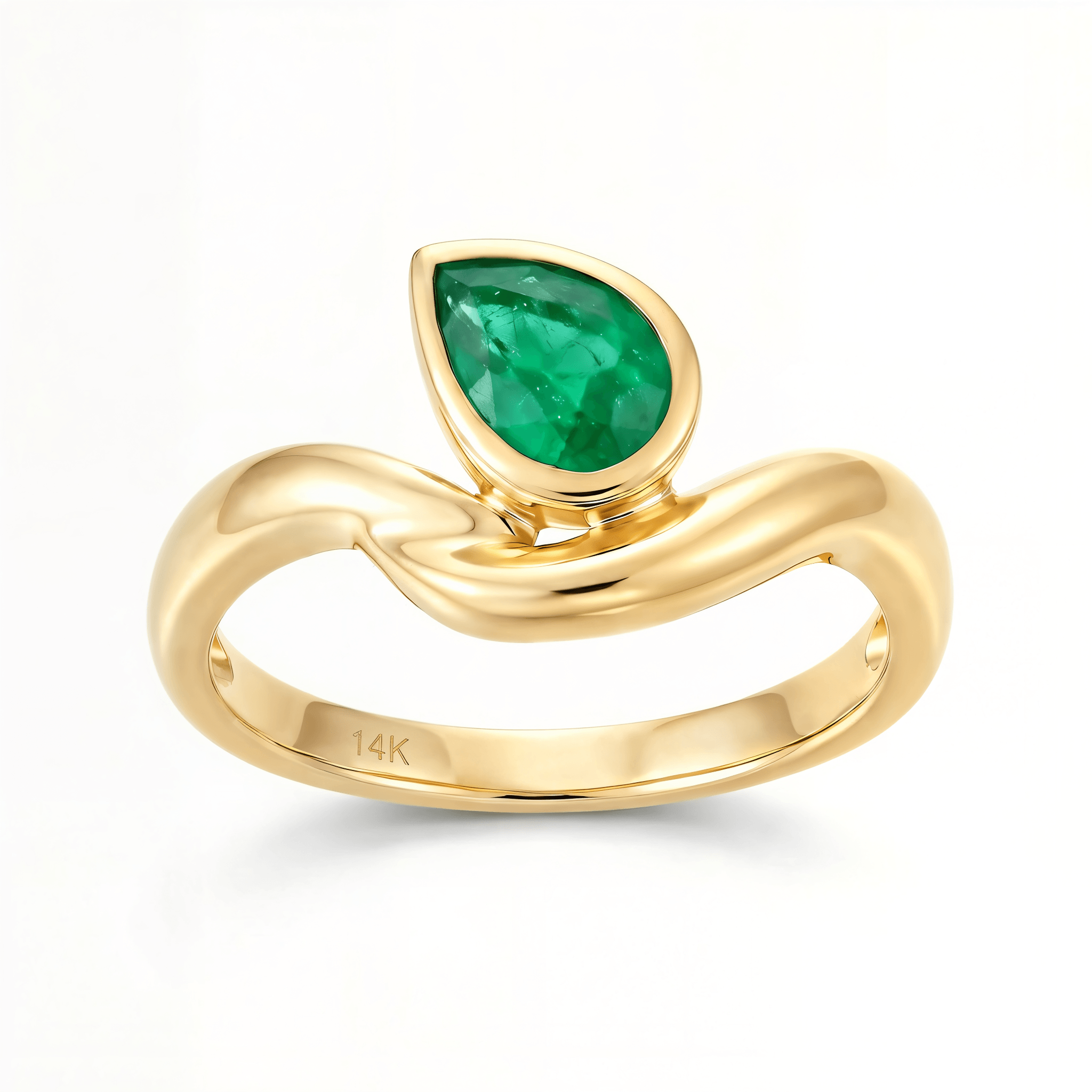 Pear Shaped Emerald Curved Ring in 14k Yellow Gold with a vivid green pear-shaped emerald.