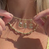 14K Gold Bubble Letter Diamond Necklace Charm with diamond-accented letters EBI on a delicate chain.
