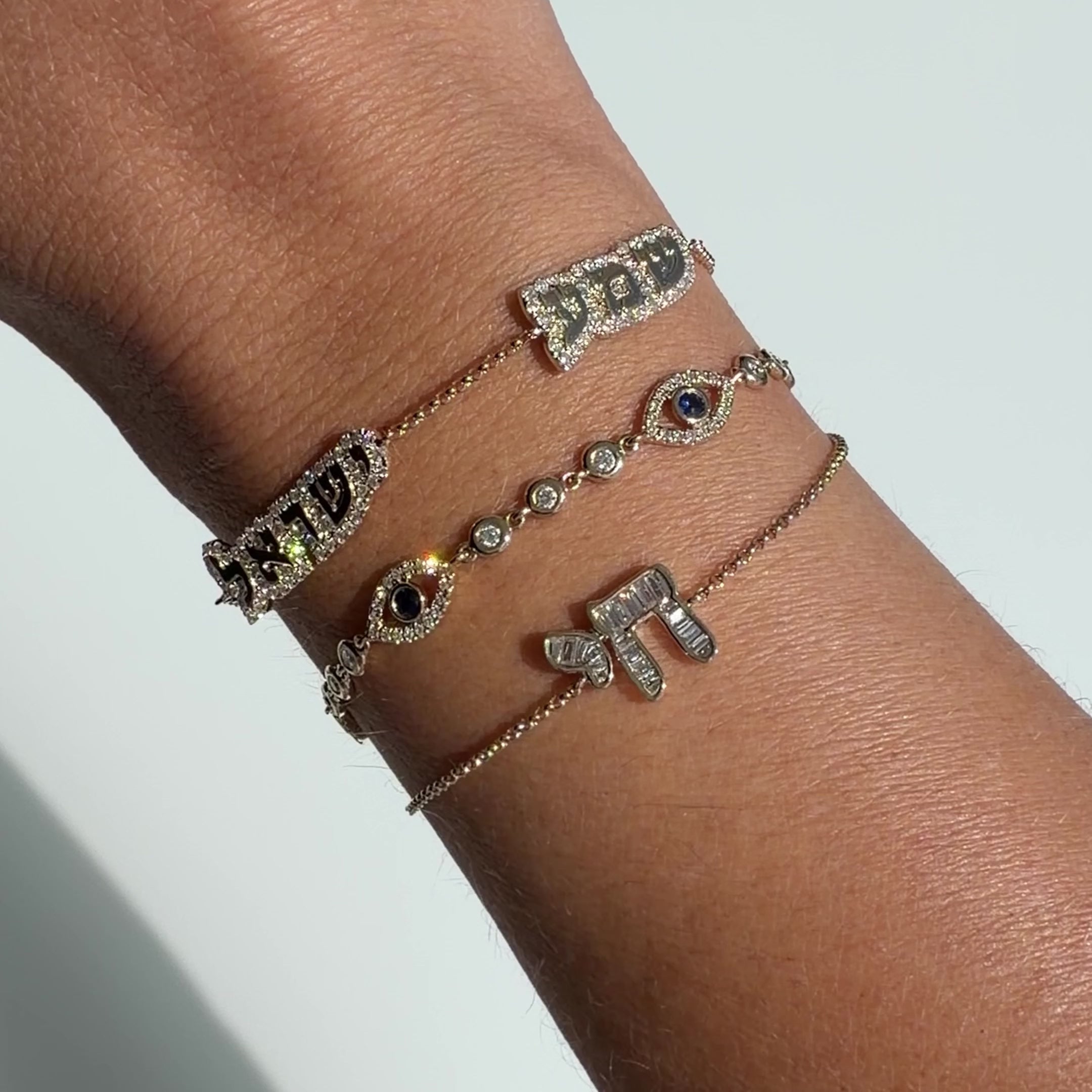 Shema Yisrael Cloud Diamond Bracelet showcased on a wrist, highlighting its 14k gold and diamond design.