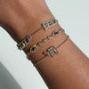 Shema Yisrael Cloud Diamond Bracelet showcased on a wrist, highlighting its 14k gold and diamond design.