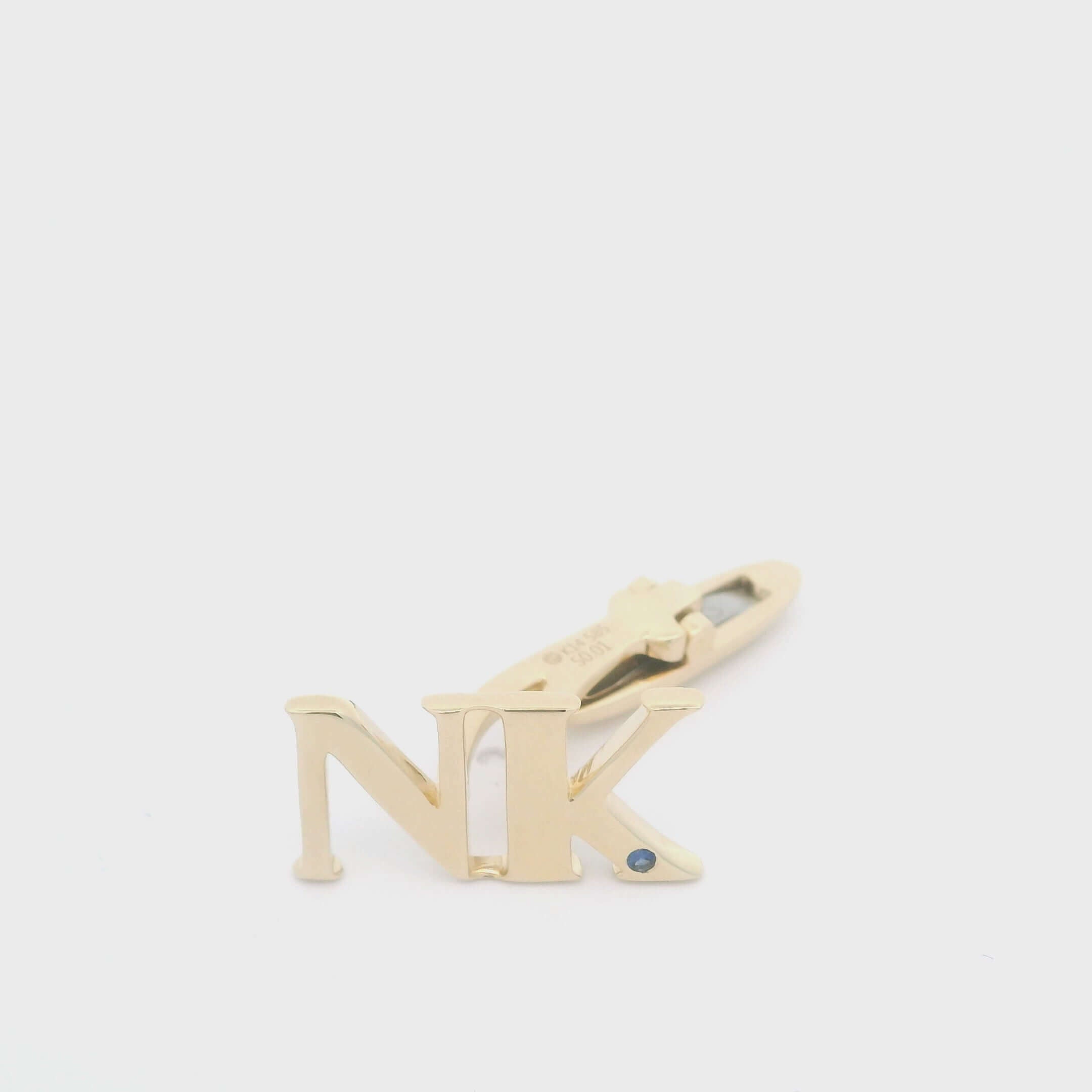 14K gold personalized initial cufflinks with gemstone, featuring the letters 'NK' for sophisticated elegance.