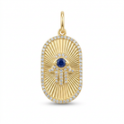 Oval gold hamsa charm with a sapphire in the center and pavé diamonds outlining the hamsa and the oval shape