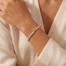 Rectangular Links Mother of Pearl & Diamond Bracelet worn on a woman's wrist, showcasing its elegant design and details.