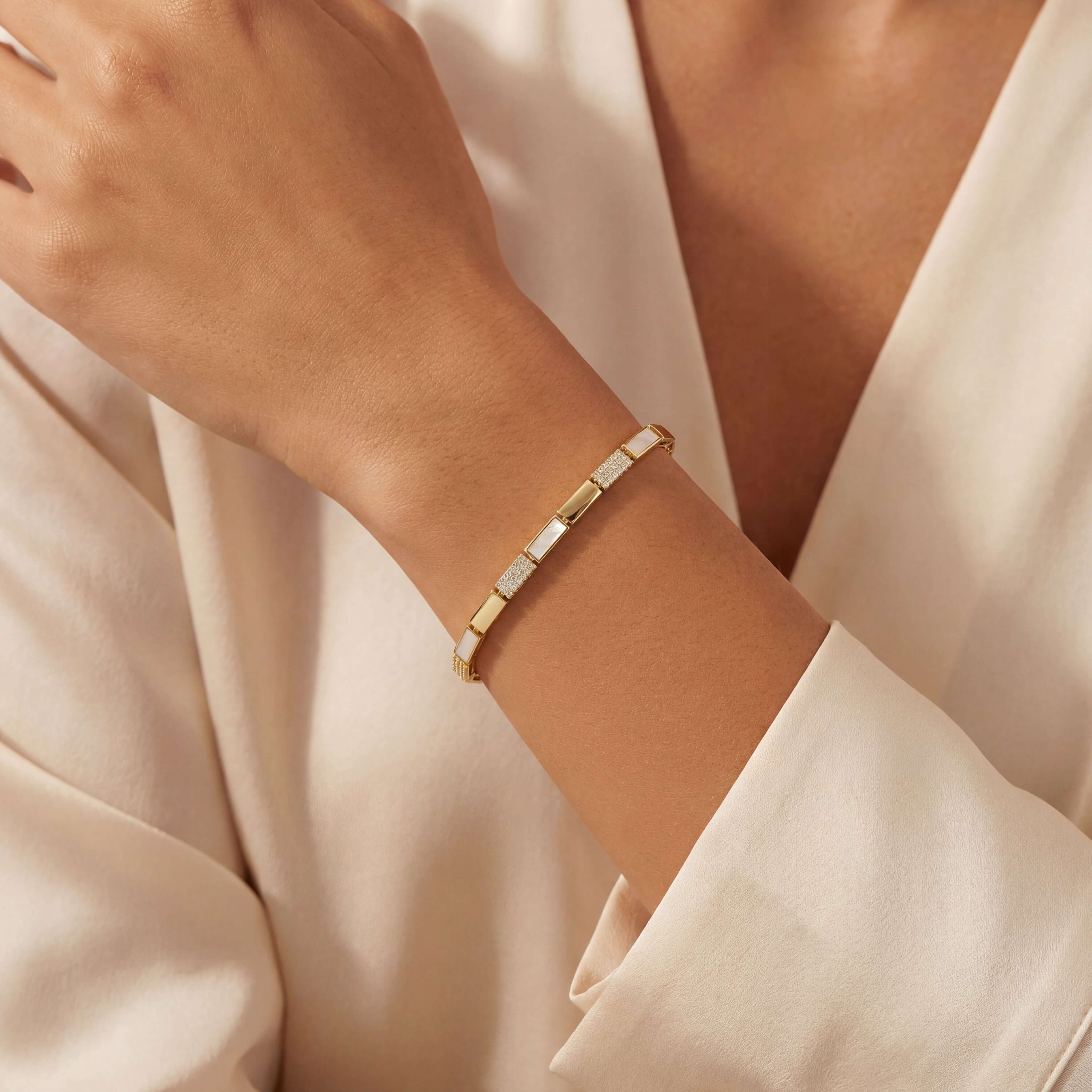 Rectangular Links Mother of Pearl & Diamond Bracelet worn on a woman's wrist, showcasing its elegant design and details.