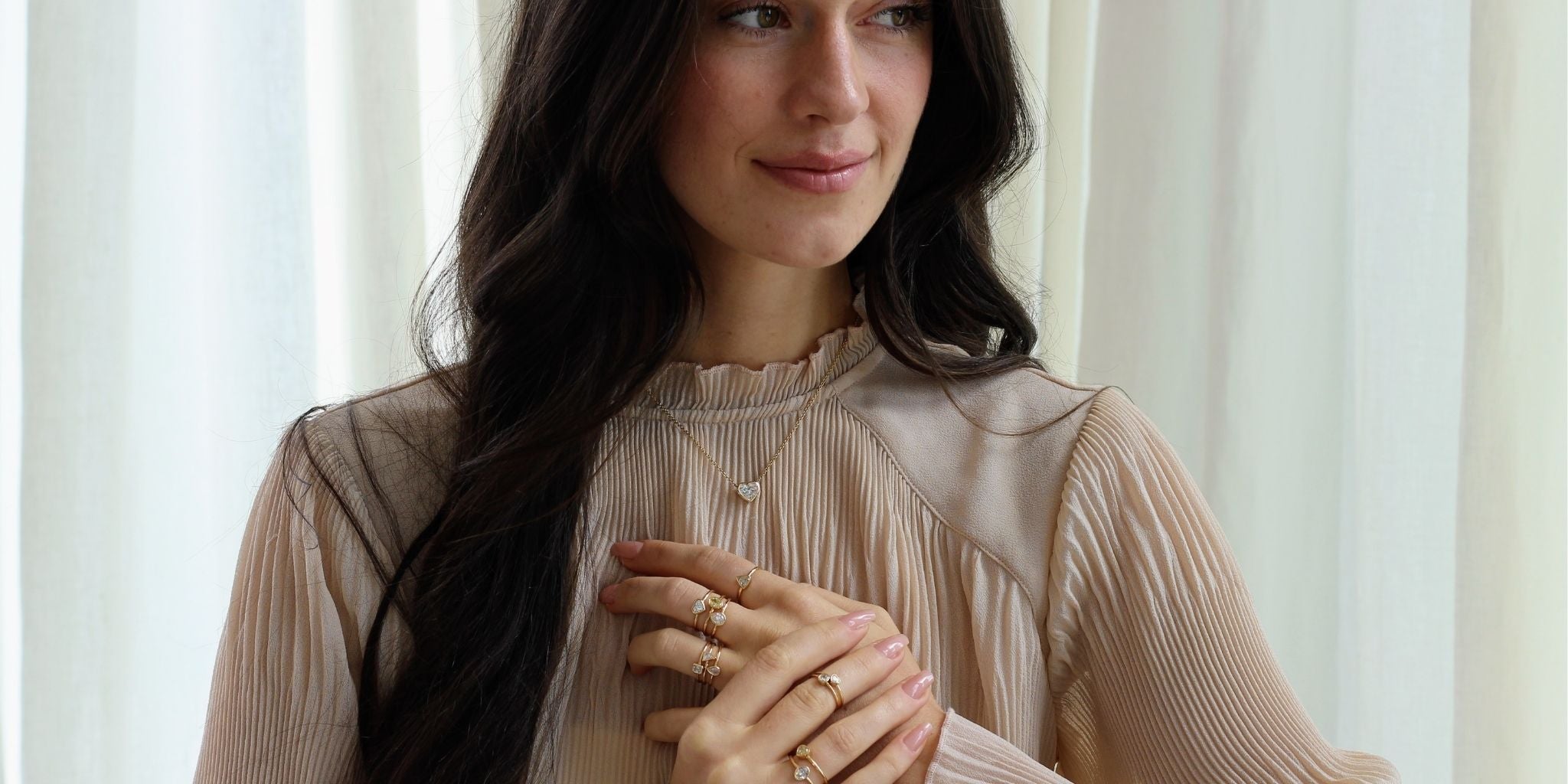 model wearing the bezel diamond rings and necklace 