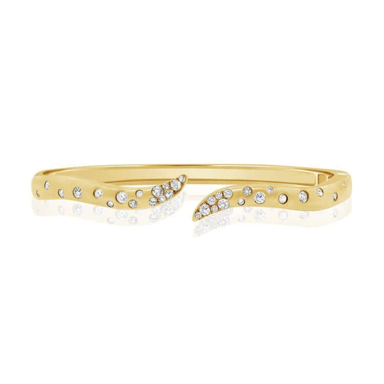 Wavy Diamond Confetti Cuff Bangle featuring a gold open cuff design with sparkly micro pavé diamonds.